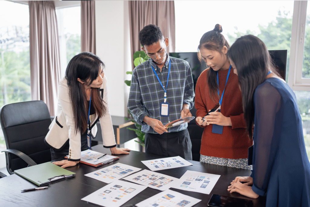 Team reviewing design mockups in modern office